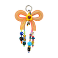 Kalesa Tangerine Bow Charm front view